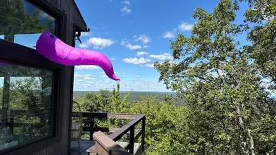 a pink shoe hanging off the side of a house at Mountain Top! Family Paradise w Hot Tub & Game Rm in Tannersville