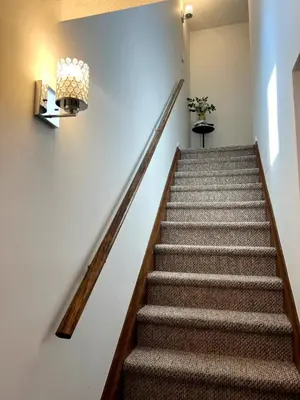 a set of stairs in a building with a stair case at Mountain Top! Family Paradise w Hot Tub & Game Rm in Tannersville