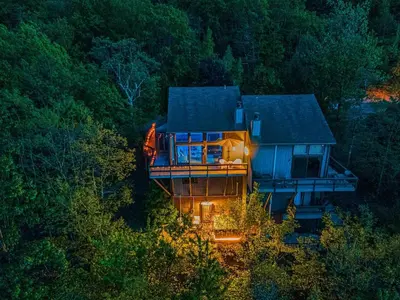 an aerial view of a house in the woods at Mountain Top! Family Paradise w Hot Tub & Game Rm in Tannersville