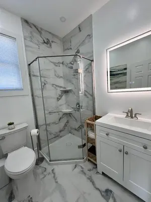 a bathroom with a shower and a toilet and a sink at 2Bed Gem-15min to NYC-3min Walk to Bus-Train in North Bergen