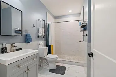 a bathroom with a sink and a toilet and a shower at Cozy Convenient 1 Bedroom with 2 Beds Near Downtown in Philadelphia
