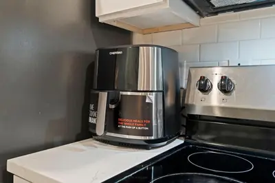 a coffee maker sitting on top of a kitchen counter at Cozy Convenient 1 Bedroom with 2 Beds Near Downtown in Philadelphia