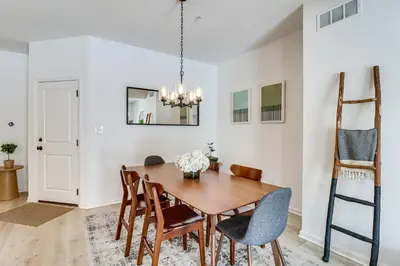 a dining room with a wooden table and chairs at Half-Mi to the Triangle! Chic Emmaus Townhome