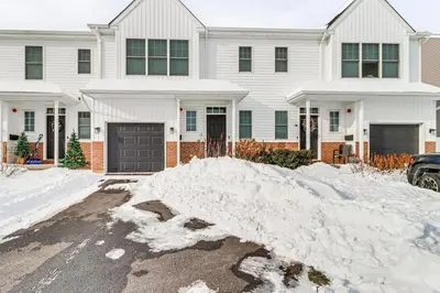 a pile of snow in front of a house at Half-Mi to the Triangle! Chic Emmaus Townhome