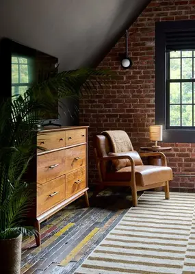 a living room with a dresser and a chair at Eleanor Inn - Suite Amelia & Lorena in Warwick