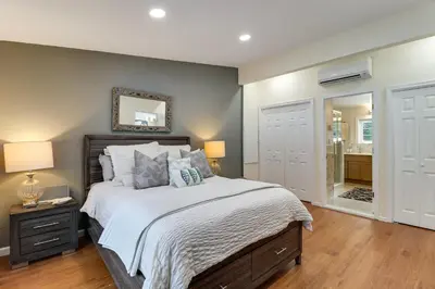 a bedroom with a large bed and a bathroom at Family-Friendly Home 6 Mi to Big Boulder Mtn! in Albrightsville