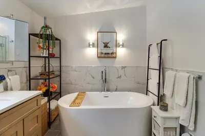 a white bathroom with a tub and a sink at Family-Friendly Home 6 Mi to Big Boulder Mtn! in Albrightsville