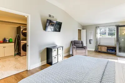 a bedroom with a bed and a chair in a room at Family-Friendly Home, 5 Mi to Roundtop Mtn Resort! in Dillsburg