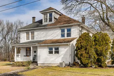 a white house with a gambrel roof at Family-Friendly Home, 5 Mi to Roundtop Mtn Resort! in Dillsburg