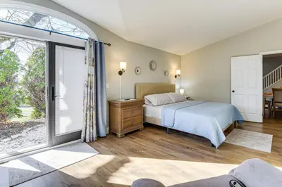 a bedroom with a bed and a sliding glass door at Family-Friendly Home, 5 Mi to Roundtop Mtn Resort! in Dillsburg