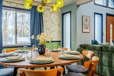 a dining room with a table and chairs at Movie Theater Game Room Resort Amenity Access in Tobyhanna