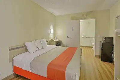 a bedroom with a large bed in a room at Value Extended Stay in Maple Shade