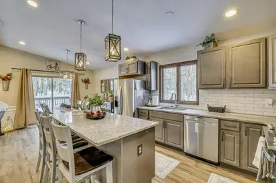 a kitchen with a large island in the middle at Newly Renovated! Peaceful Saylorsburg Home in Saylorsburg