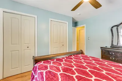 a bedroom with a bed and a ceiling fan at Pet Friendly and WFH Ready! Quiet Hudson Valley Apt in Newburgh