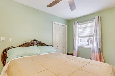 a bedroom with a bed and a window at Pet Friendly and WFH Ready! Quiet Hudson Valley Apt in Newburgh