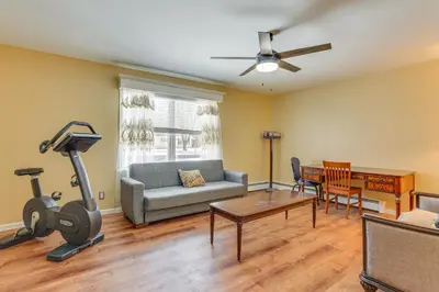 a living room with a couch and a treadmill at Pet Friendly and WFH Ready! Quiet Hudson Valley Apt in Newburgh