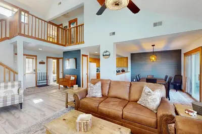 a living room with a couch and a table at Mountain View Memories at Northridge in Tannersville