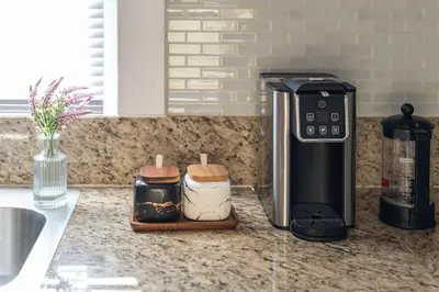 a kitchen counter with a coffee maker and a toaster at New home, 17 min to NYC, 5 min to MetLife Stadium in Carlstadt
