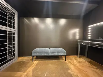 a bench in a room with a table and a window at The Vault - Hidden Playroom For Couples - Private Hot Tub - Mountain Views - Riverfront in Barryville