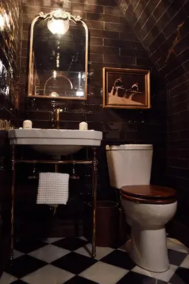 a bathroom with a toilet and a sink at Romantic AFrame Cabin with Firepit, BBQ in Pocono Pines