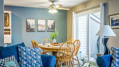 a living room with a table and chairs at Mountain Laurel Lodge by AvantStay Lake Harmony Retreat • Loft Games Ski Private Club Access in Lake Harmony