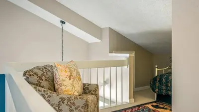 a living room with a couch and a chair at Mountain Laurel Lodge by AvantStay Lake Harmony Retreat • Loft Games Ski Private Club Access in Lake Harmony