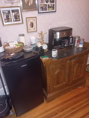a kitchen with a microwave and a coffee maker on a counter at Oakland House Apartments in Phoenixville