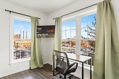 a dining room with a table and a window at Urban Haven XL - NYC & Newark with free parking in Newark