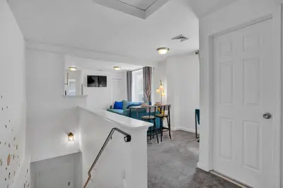a room with a white door and a dining room at Renovated 2BR in Germantown in Philadelphia