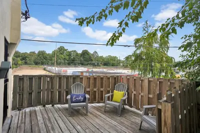 two chairs sitting on a deck with a fence at Renovated 2BR in Germantown in Philadelphia