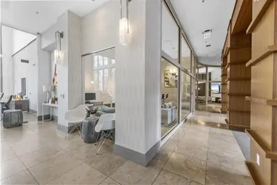 a living room with a table and chairs at Landing Amazing 1BD Gym Game Room in Bayonne