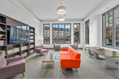 a living room with a couch and chairs and a table at Landing Amazing 1BD Gym Game Room in Bayonne