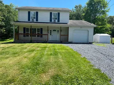 a house with a large yard in front of it at Home in Poconos in Albrightsville