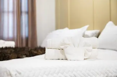 a pile of towels sitting on top of a bed at Summit Stay Near Kalahari & Raceway in Pocono Summit