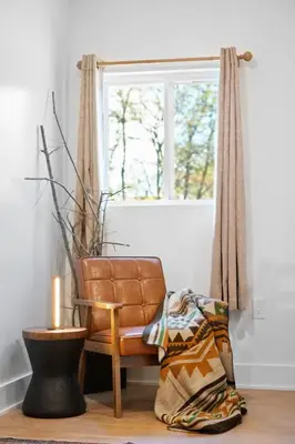 a living room with a chair and a window at Summit Haus Cozy Getaway in the Poconos in Pocono Summit