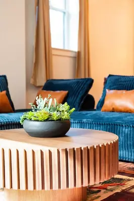 a living room with a table with a plant on it at Summit Haus Cozy Getaway in the Poconos in Pocono Summit