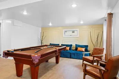 a living room with a pool table and a couch at Summit Woods Hideaway Cozy Pocono Getaway in Pocono Summit