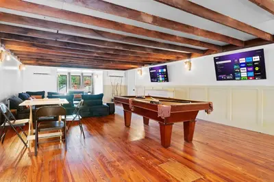 a living room with a pool table in it at Lakeside Serenity Retreat Near Kalahari Resort in Pocono Summit