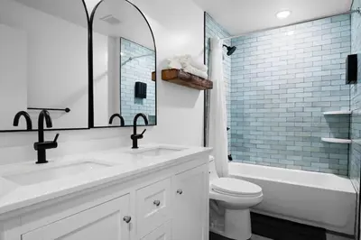 a bathroom with a sink and a toilet and a tub at Lakeside Serenity Retreat Near Kalahari Resort in Pocono Summit