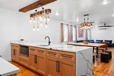a kitchen with a sink and a counter top at Modern Mountain Escape Sleeps Large Groups in Pocono Summit