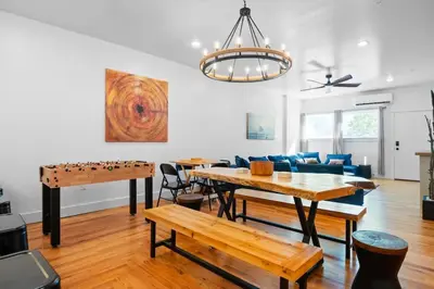 a living room with a ping pong table and a couch at Pocono Summit Lodge Game Room & Family Fun in Pocono Summit