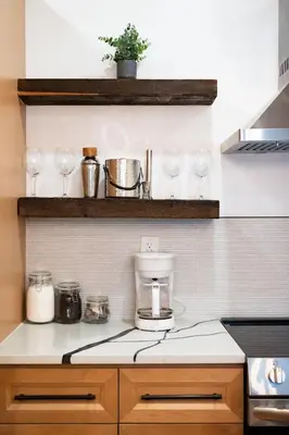 a kitchen counter with wine glasses and a coffee maker at The Grand Pocono Getaway Waterparks & Raceway in Pocono Summit