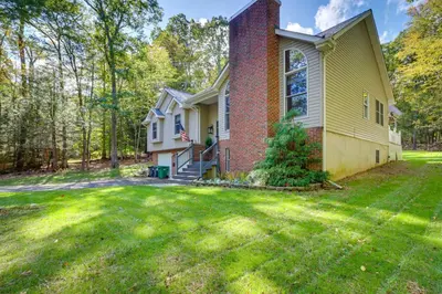 a house with a lawn in front of it at Hot Tub and Game Room Retreat Near Camelback in Reeders