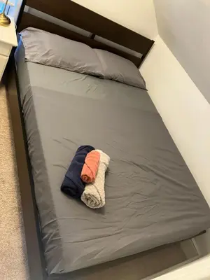 a small bed in a room with at Quite and Sweet guest room near nyc in Guttenberg