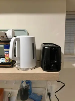 a counter with a coffee maker and a toaster on it at Comfort guest room near everything in Guttenberg