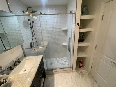 a bathroom with a shower and a sink at Modern Glam Getaway 30 minutes from NYC in West Orange