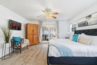 a bedroom with a bed and a ceiling fan at The Waters Edge Escape in East Stroudsburg