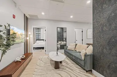 a living room with a couch and a table at Apartmint at The Metropolitan1 - Philadelphia in Philadelphia