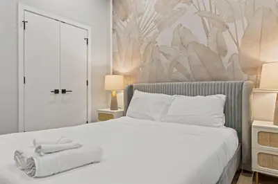 a bedroom with a bed with towels on it at Apartmint at The Metropolitan1 - Philadelphia in Philadelphia