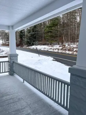 a porch with snow on the side of a road at Kenoza Lake Waters wLake AccessCanoeIce-fish in Callicoon